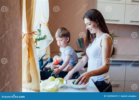 Kitchen Mom Son Wash Fruits And Vegetables Stock Photo Image Of Drink