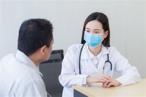 Asian Female Doctor Asking Patient Questions Stock Image Image Of