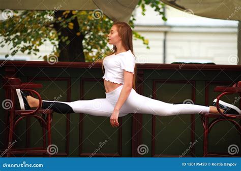 Athletic Gymnast Girl Doing Fitness Exercise Stretching Splits Stock