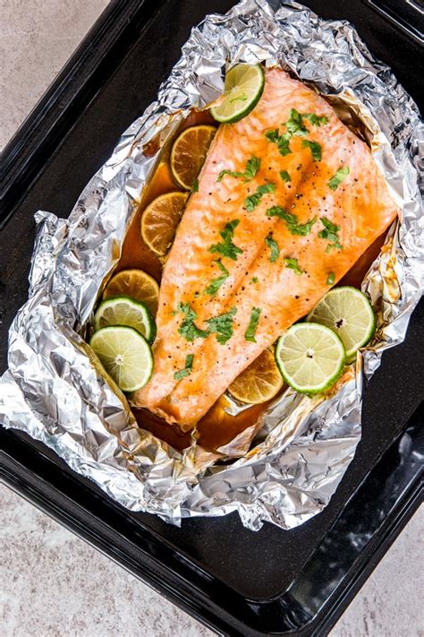 Take 2 pieces of large aluminum foil squares, and place half of salmon, asparagus, and. Honey Teriyaki Lime Salmon Baked in Foil - Dan330