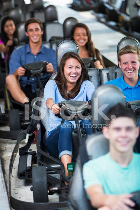 Group Of Teens At Amusement Park On Gocarts Stock Photo Royalty Free