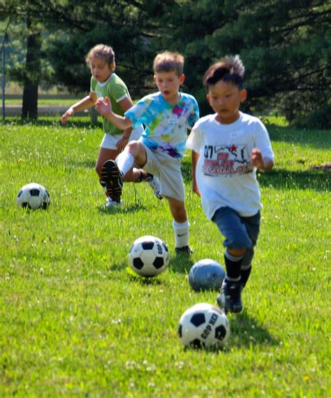 Kids Kicking Ball Soccer Camp