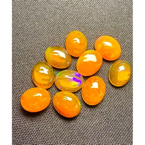 โอปอลสีส้ม ทรงรี 9x7 มม พลอยธรรมชาติ 100 Orange Opal 9x7mm Oval Shape