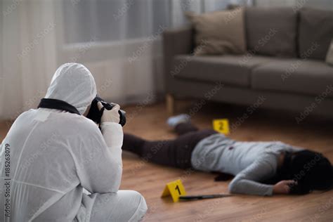 Criminalist Photographing Dead Body At Crime Scene Stock Photo Adobe