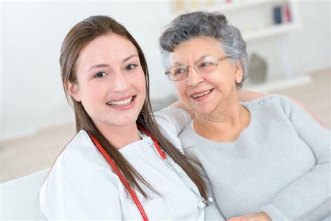 Old Lady Smiling To Nurse Stock Image Image Of Nurse 100302299
