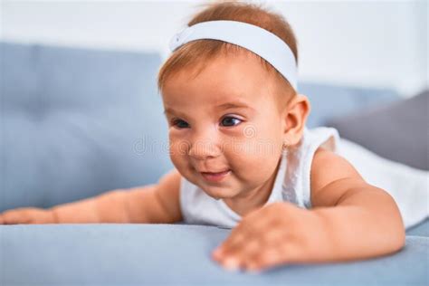Adorable Baby Lying Down On The Sofa At Home Stock Image Image Of