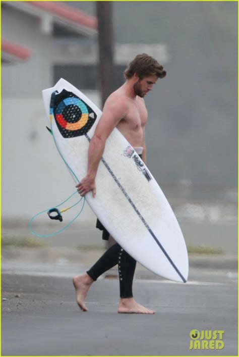 Liam Hemsworth Bares Hot Bod While Stripping Out Of Wetsuit Photo