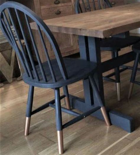 Upholstering your chairs can give your dining room a warmer, more cozy feel. Update Dining Chairs: Paint Navy w/ Gold-Dipped Legs ...