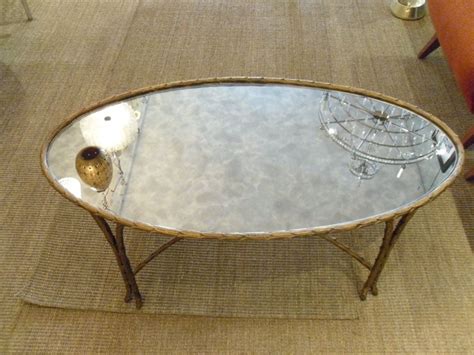 Pecan medium oval wood coffee table set with nesting tables. Jansen Gilt Reeded Oval Coffee Table with Mirrored Glass ...