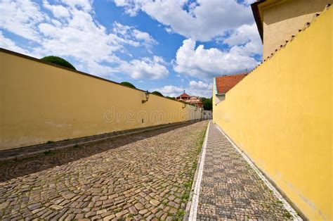 Narrow Cobblestone Street With Wall Prague Czech Republic Stock Photo