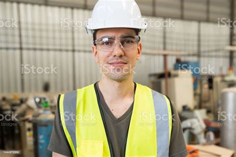 Portrait Of Male Engineer Worker Wear Safety Uniform Glasses And Helmet