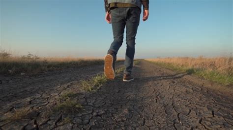 Unknown Man Walking Away Down A Rural Road Stock Footage Videohive