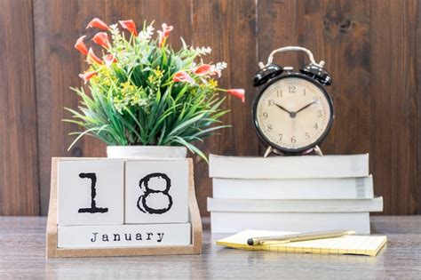 Premium Photo January Date On A Wooden Cube Calendar With Blur