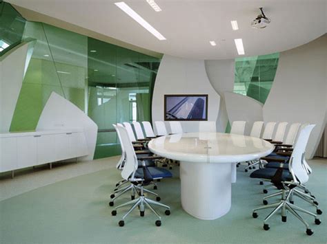 The name itself implies that it's designed for larger gatherings with many attendees rather than for the regular office meeting. small office meeting room design with beige finish solid ...