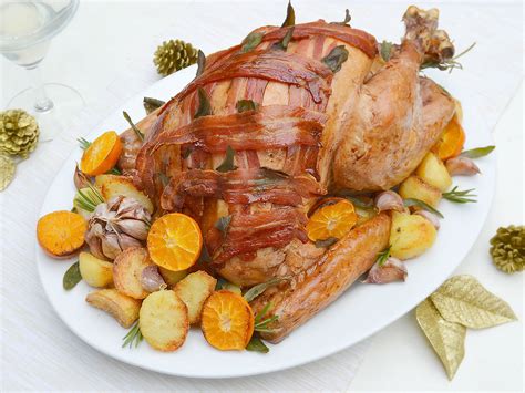 Bacon Topped Roast Turkey With Clementine Sage And Garlic Butter