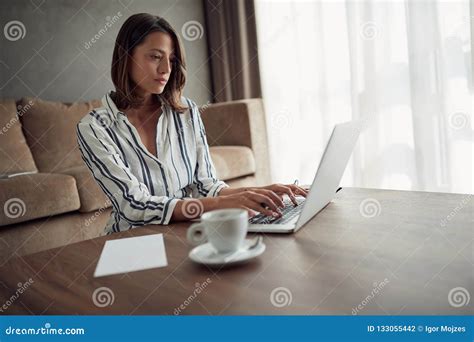 Businesswoman Works For A Computer From A Home With A Laptop A Stock