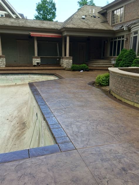 Stamped Concrete Pool Deck With Custom Chiseled Stone Cantilevered