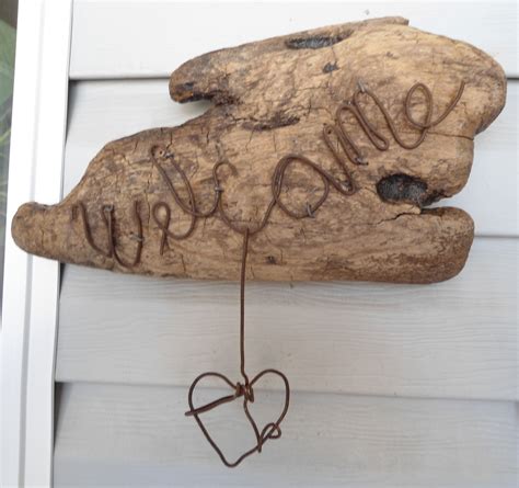Homemade wood pirate signs, bar signs, boating signs, lake signs, sports signs, nature signs, cabin signs, and custom signs, hand painted on driftwood. Rustic Driftwood Welcome Sign WELCOME rusty wire - Home ...