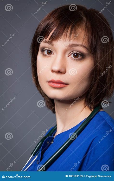 Portrait Of A Young Nurse During Hard Working Day Brunette With A