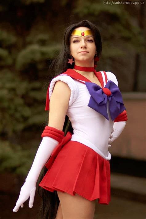 A Woman Dressed In A Red And White Outfit