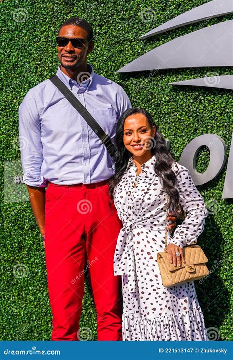 american professional basketball player chris bosh with his wife adrienne williams on the blue