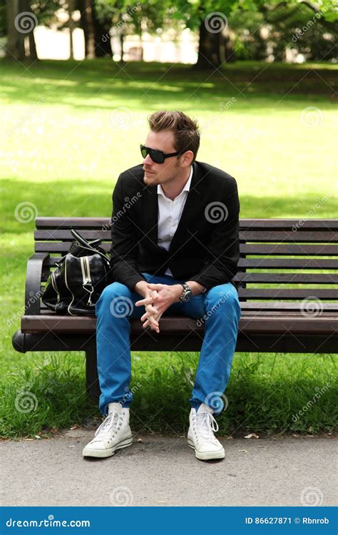 Man Sitting Down On A Bench Stock Image Image Of Handsome Leather 86627871