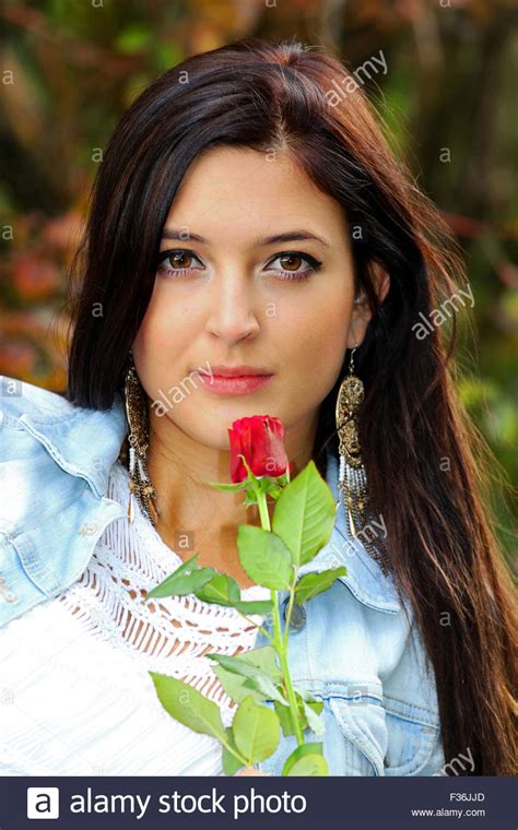 Beautiful Brunette With Red Rose Stock Photo Alamy