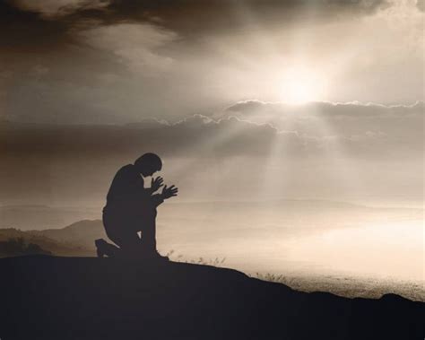 Humble Man Kneeling Praise Worship God Mountain Sunset Background