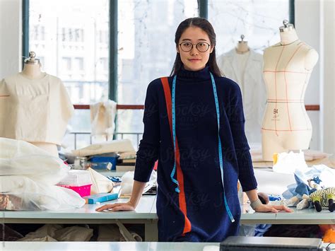 Chinese Fashion Designer In Fashion Design Studio Portrait By Vuelyfe