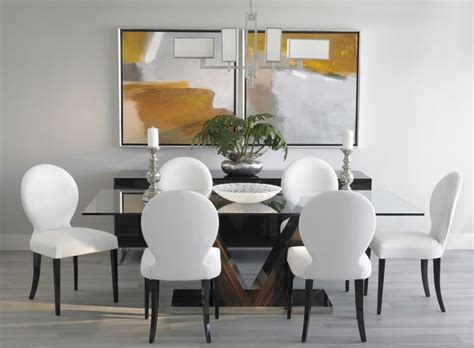 Modern grey kitchen an artwork by mircea suciu hangs on the sliding wall of bleached mahogany that separates the kitchen from the dining area in this contemporary palm springs apartment. Grey hardwood floors - How to combine gray color in modern interiors?