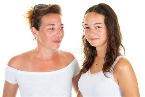 Brunette Mother Middle Aged And Teenager Daughter Standing Isolated Over White Background Stock