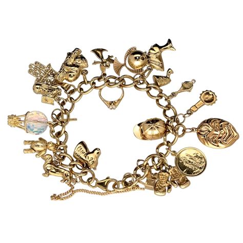 9ct Yellow Gold Ladies Charm Bracelet 22 Charms 4410 Grams Miltons