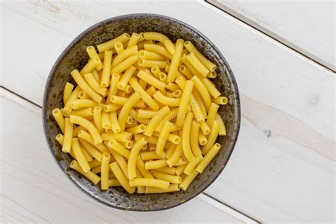 Raw Macaroni Pasta On Grey Wood Stock Image Image Of Light Curved
