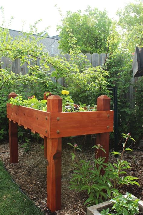 This cedar raised planter box from 'angela marie made' takes just a few hours to build. DIY Raised Planter Box - A Step-by-Step Building Guide