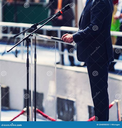Male Speaker Standing In Front Of Microphones Stock Photo Image Of