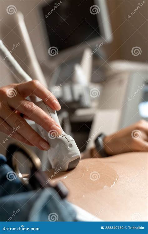 Ultrasound Diagnostics Of The Stomach On The Abdominal Cavity Of A Girl In The Clinic Close Up