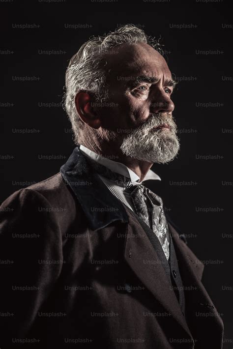 Vintage Characteristic Senior Man With Gray Hair And Beard Studio Shot