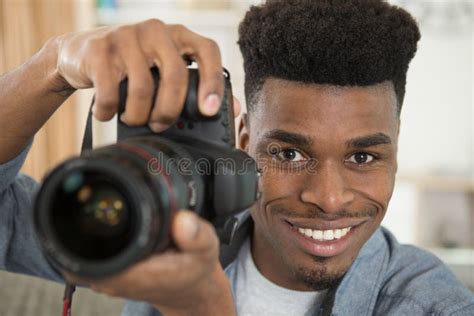 Happy Handsome Young Photographer Holding Professional Photo Camera