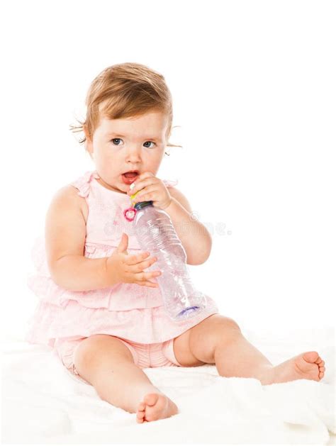 Little Girl Is Drinking From Bottle Stock Photo Image Of Healthy