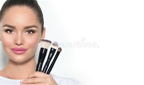 Beauty Model Girl Makeup Artist Holding Set Of Make Up Brushes And