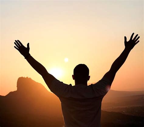Premium Photo Silhouette Of A Man With Outstretched Arms At Sunset
