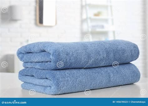 Stack Of Fresh Towels On Table In Bathroom Closeup Stock Image Image