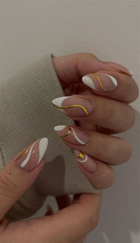 35 Nail Trends 2023 To Have On Your List White And Gold Swirl Nails