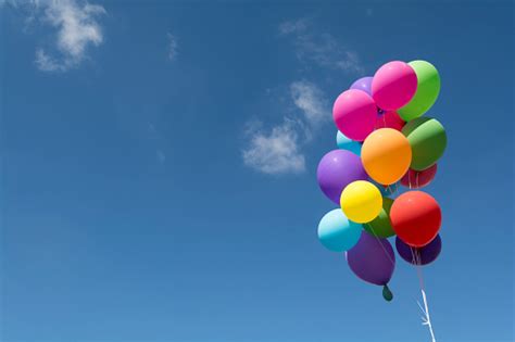 Colorful Balloons Flying In The Blue Sky Stock Photo Download Image