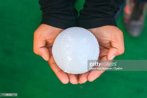 Child Hand Holding Ball Photos And Premium High Res Pictures Getty Images