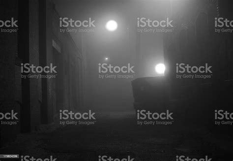 Dark Foggy Urban Alleyway In Black And White Stock Photo Download