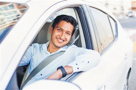 Premium Photo Young Handsome Indian Man Driving A Car