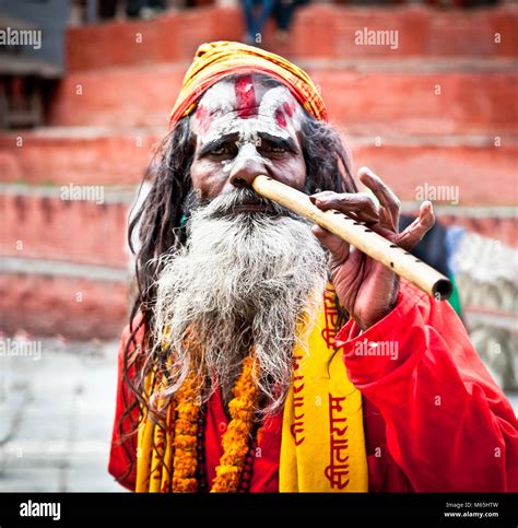 kathmandu nepal may 18 sadhu play flute at pashupatinath temple in kathmandu nepal on may 18