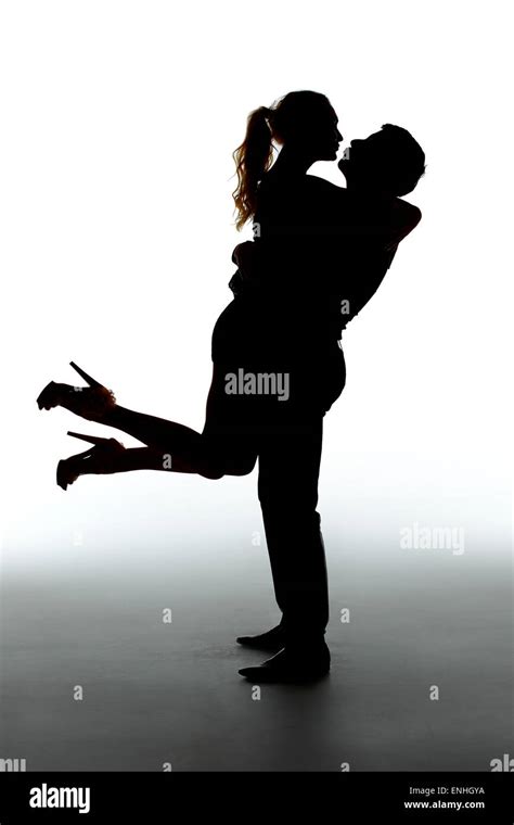 Romantic Couple Kissing Silhouettes On White Background Stock Photo