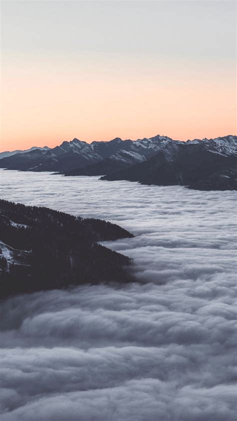 Download Wallpaper 1350x2400 Mountains Clouds Dusk Aerial View
